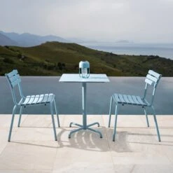 PICO Outdoor Café Table W/ 4-Star Base - Square -Danish Design Store ALUA Dining without armrest ice blue PICO 60x60 4star base ice blue HOUE 3298 high 0004 Background