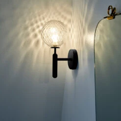 Miira Wall Light -Danish Design Store Nuura Miira wall optic lifestyle 2