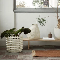 Ferm LIVING Ceramic Basket -Danish Design Store fermLIVING AW21 CeramicBasketXLOffWhite KonaDisplayTable UraScentedCandleBurnedSienna image 0697479a d25e 4d79 a943 610a950947f2